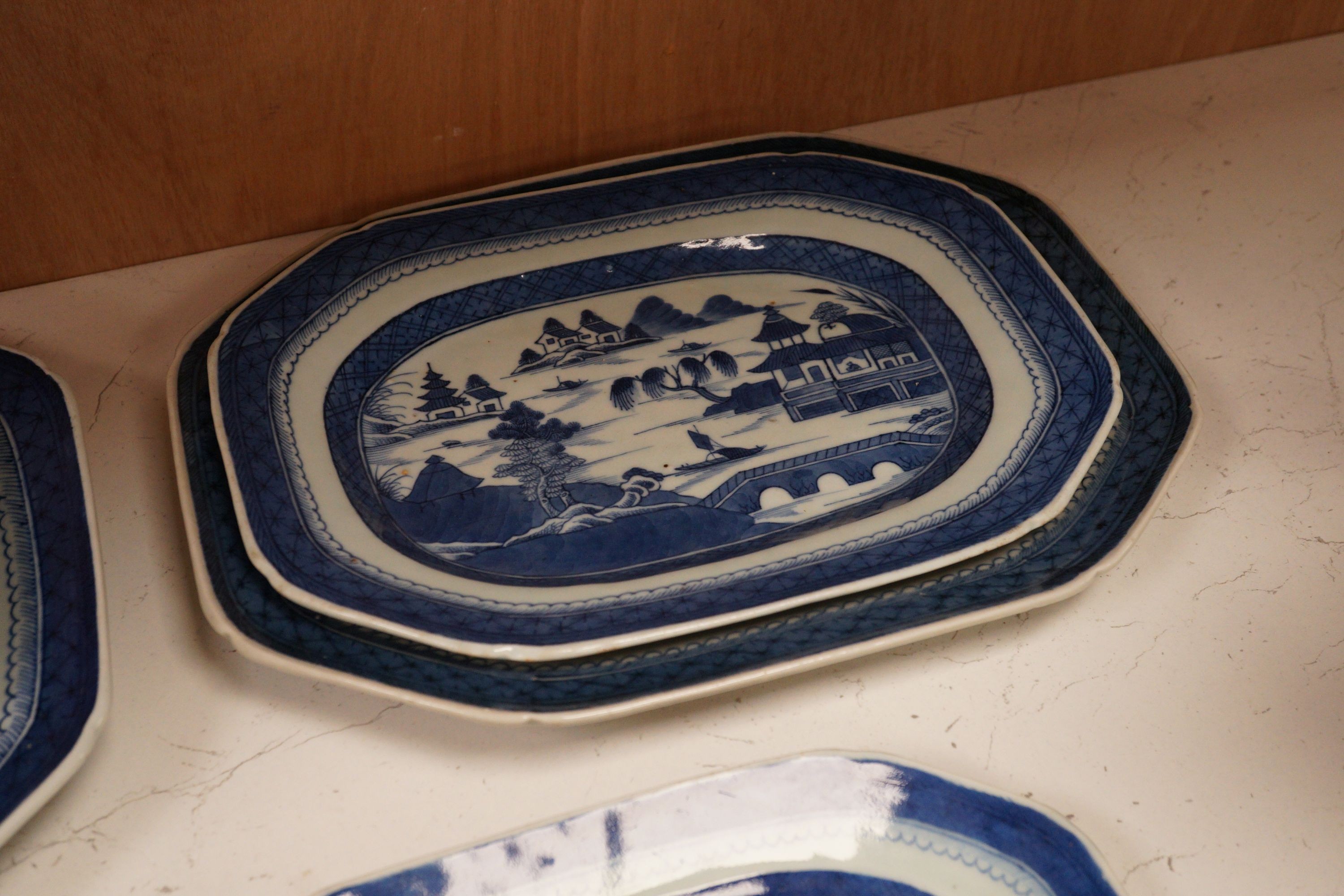 A group of Chinese blue and white porcelain, early 19th century, to include five graduated trays, and two tureens